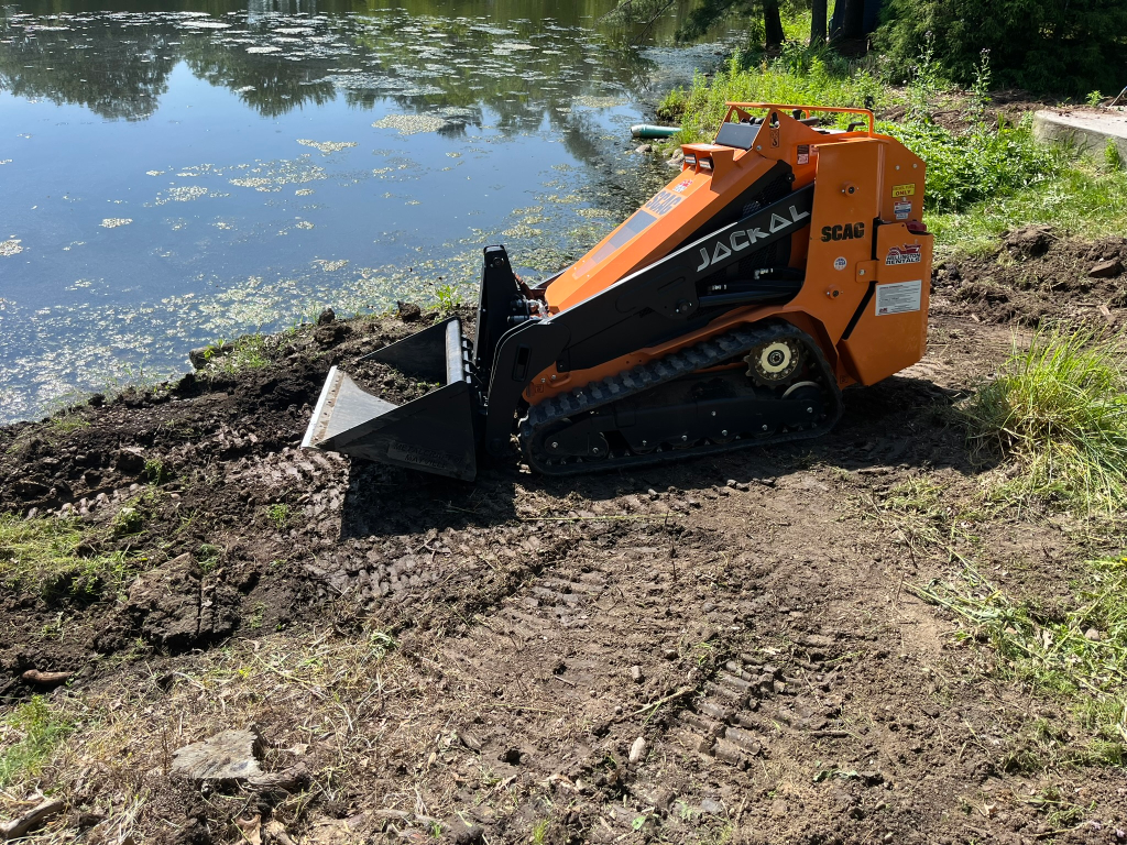 Mini Skid steer grading and site preparation by EZGreen Lawn Care in Medina, Ohio